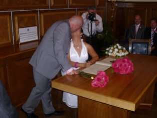 wedding-kissing-signing-register